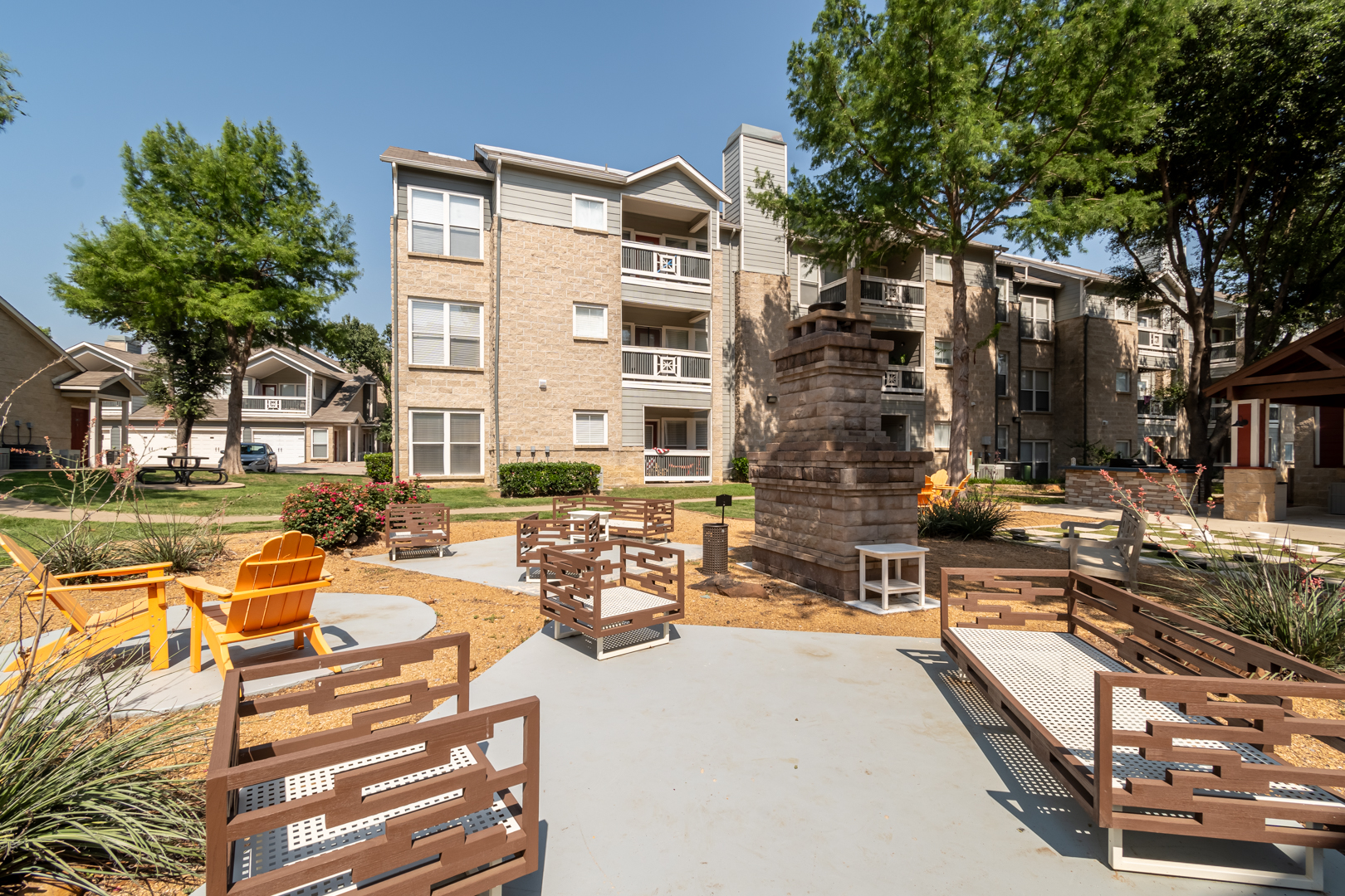 a park with benches and a building